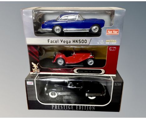 Three 1:18 scale die cast vehicles : MG TC Midget, Facelvega HK500 and a Prestige Edition American convertible 