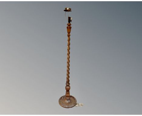 An Edwardian oak barley twist standard lamp  