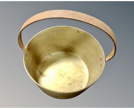 A vintage brass cast iron handled jam pan.