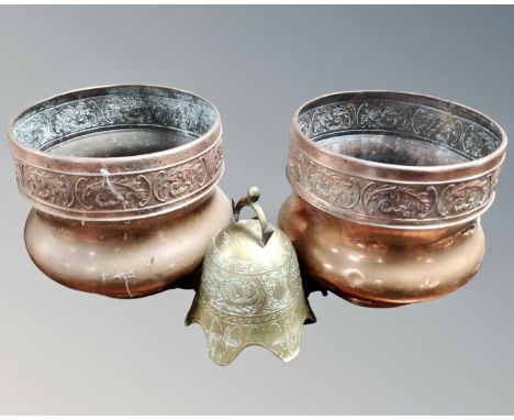 A pair of vintage embossed copper planters together with a brass embossed Oriental style bell.