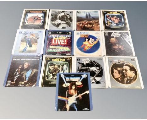 A collection of 13 vintage video discs including The Wizard of Oz, Charlie Chaplin in City Lights, Steve Miller band etc.