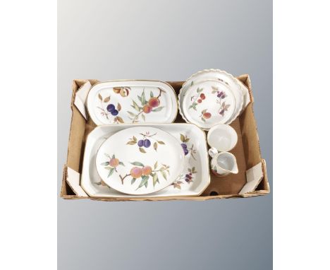 A group of Royal Worcester Evesham china including milk jug, sugar basin, serving plates etc.