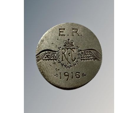 A coin inscribed E R Royal Flying Corps 1916