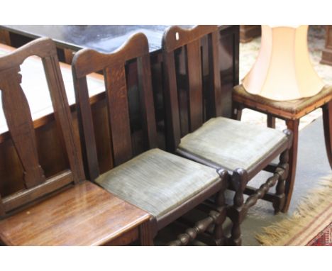A pair of 18th century oak slat back chairs, bobbin and block legs with one other