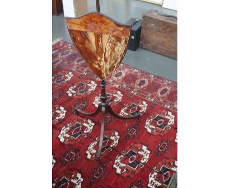 A Georgian mahogany adjustable fire screen, in the Hepplewhite taste, turned stem on three splayed feet