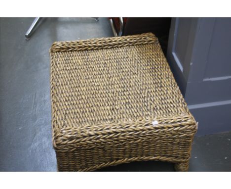 A 20thC laquered wicker stool, 70cm wide