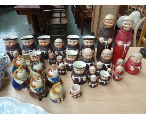 A large quantity of Goebel Pottery Friar and Cardinal Tuck ceramics including two novelty flasks with head as stopper, jugs, 