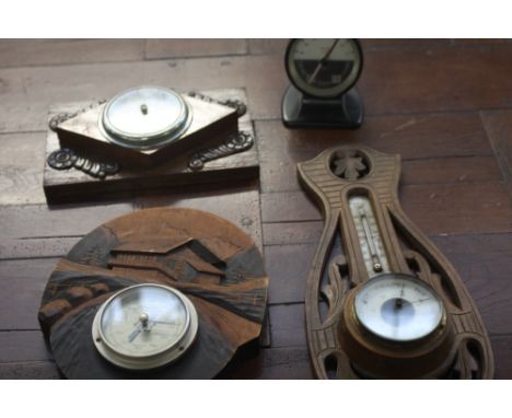 A Tendance Incertaine barometer on carved chalet frame, a Solar Aneroid Barometer, with two more wood frame carved barometers