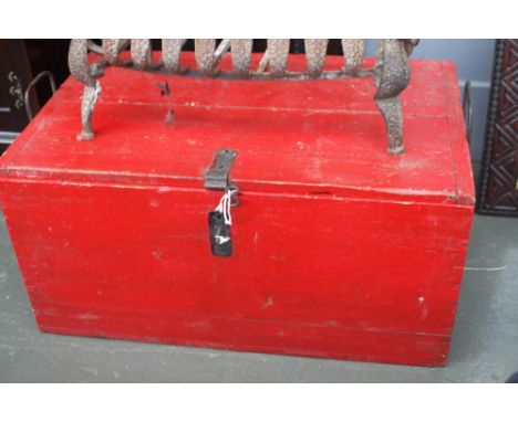 A vintage red painted pine trunk, with itron side handles, 80cmW