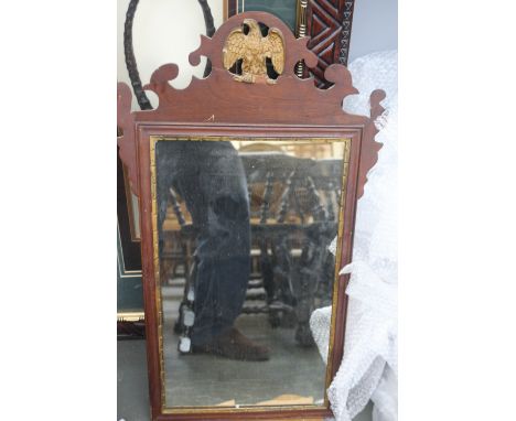 An Empire wood framed rectangular mirror with gilt eagle finial, 49cm x 86cm