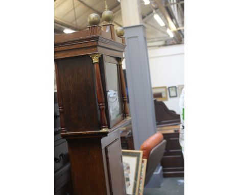 A George IV oak longcase clock case with brass finish, 205cm high