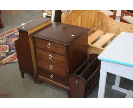 A modern stained wood small 4 drawer chest with a small book shelf and magazine rack