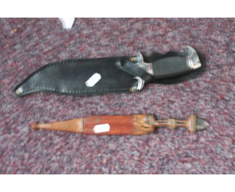 A modern Egyptian dagger with leather covered scabbard, with a modern bowie knife