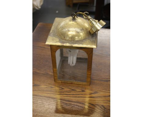 A brass and glass hanging lantern with fittings