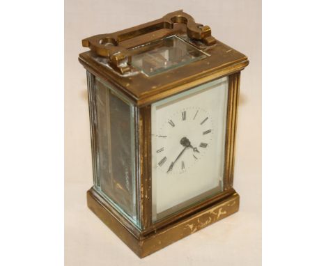 A good quality carriage clock with rectangular dial in brass traditional glazed case