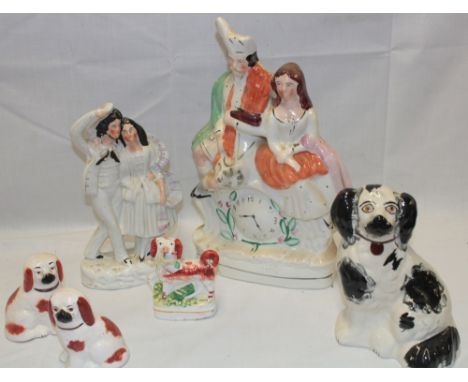 A Victorian Staffordshire Pottery figure of a Highland male and female on clock base 13½" high, Victorian Staffordshire Potte