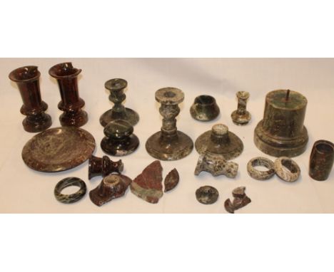 A selection of Cornish serpentine including damaged vases, candlestick, napkin rings and various other pieces 