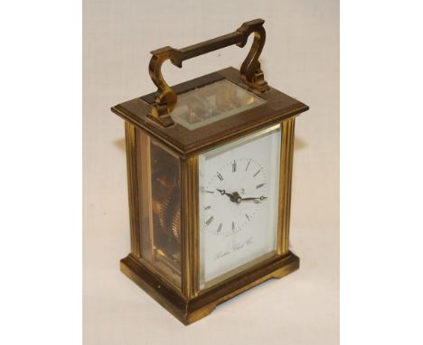A good quality carriage clock by the London Clock Co. in brass traditional case