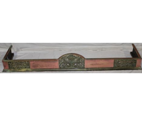 An ornate Victorian copper and brass fire fender with pierced and scroll decoration, Rd. No. 735/8 57" long overall 