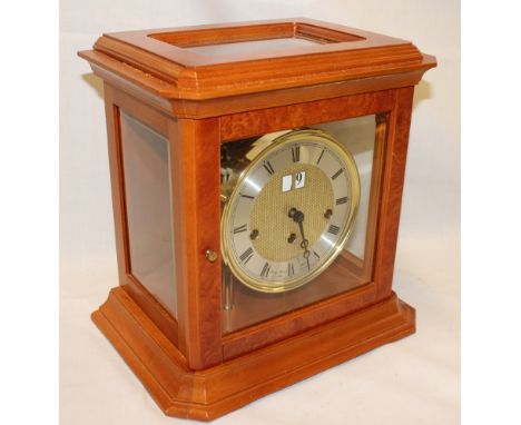 A good quality modern mantle clock by Franz Hermle & Son Germany with silvered circular dial and four-bell chiming movement i