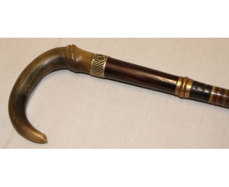 A good quality walking stick with sectioned horn body and natural horn handle
