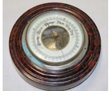 An aneroid barometer in Cornish red serpentine circular case, 6½" diameter 