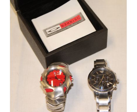 A gentleman's wrist watch by Armani in stainless steel mounts and one other boxed Oakley gent's wrist watch 