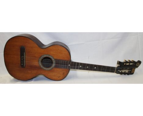 An unusual nine string guitar in rosewood case with mother of pearl mounts bearing the label "Sold by J Geo. Morley, Harp Mak
