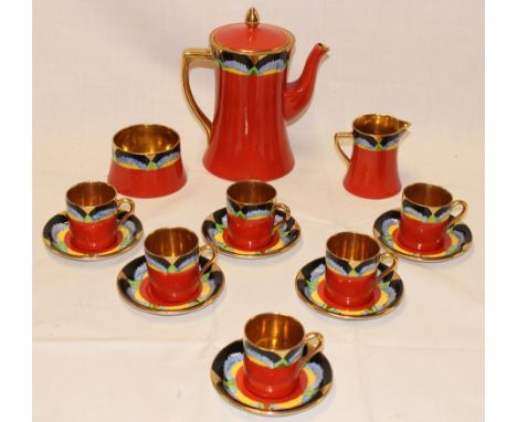 A Carltonware china coffee set with multicoloured borders comprising a tapered coffee pot, milk jug, sugar basin, six coffee 