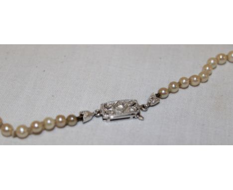 A pearl graduated necklace with 18ct white gold clasp mounted with diamonds 