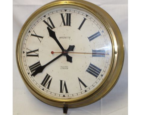 An electric wall clock by Magneta of London with circular dial in brass case, 14½" diameter 