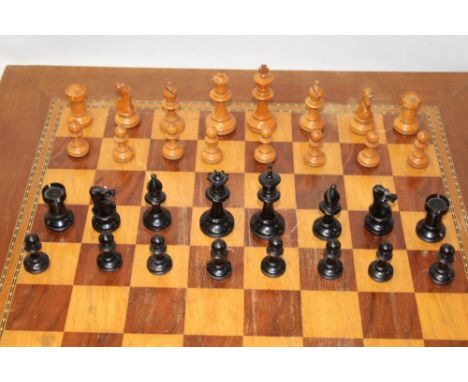 A good quality Staunton polished wood chess set (height of King 2¾") in polished mahogany case with two chessboards 