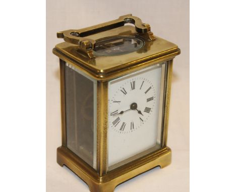 A French carriage clock with rectangular enamelled dial in brass traditional glazed case