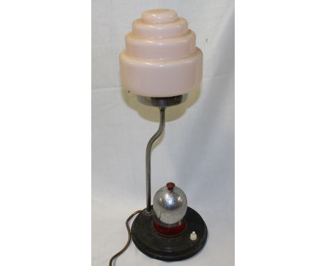 An Art Deco chromium plated table lamp with pink tinted glass stepped shade 