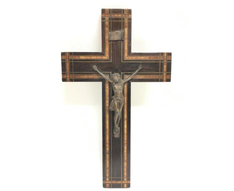 A crucifix inlaid wooden cross with a bronze figure of christ, dimensions approximately 25x15cm. Postage category C