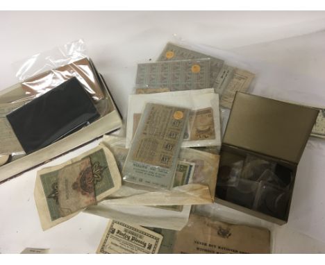 A collection of bank notes some bronze coinage including George III cart wheel pennys military service books and food coupons