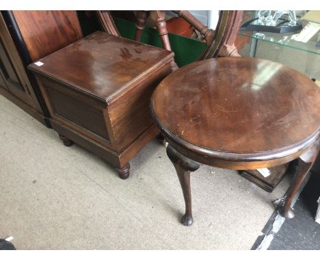 A Victorian commode with a hinged seat and a mahogany occasional table with a circular top.(2)