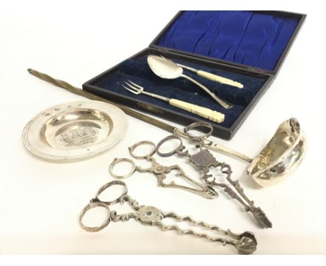 A collection of silver hallmarked items including a dish, a silver hallmarked ladle, sugar snips, cutlery etc. postage catego