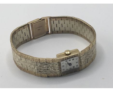 A ladies 9carat gold two tone Favre-Leuba manual wind watch with a rectangular dial seen working in good condition. All in we