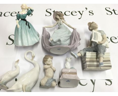 A collection of seven figures including Lladro NAO and Royal Doulton. Postage D.
