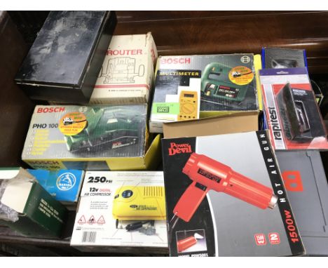 A collection of power tools including hot air gun a router and jigsaw etc. Postage D