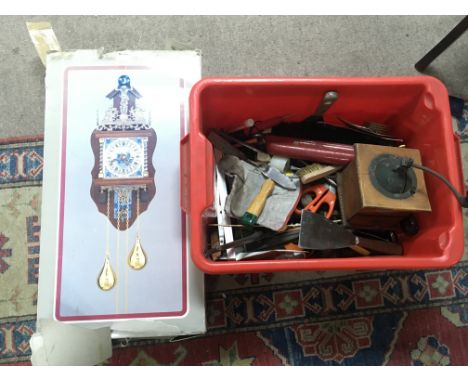 A collection of vintage tools and a boxed Alma wall clock