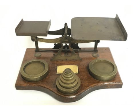 A set of brass office beam balance scales with a set of weights. This lot cannot be posted. 