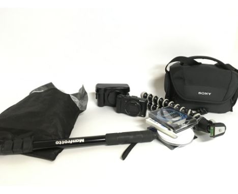 A Sony Cyber Shot DSC-HX50v camera with various camera accessories including a tripod, cables etc. Postage category C