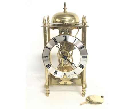 A Sewills skeleton brass mantle clock, 24cm tall approximately. postage category C- NO RESERVE