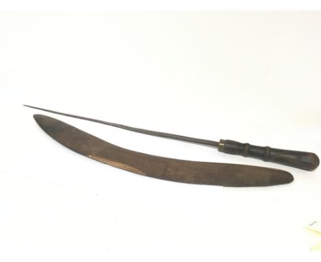 A carved hardwood Aboriginal boomerang and an African sword with leather grip and steel blade.