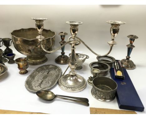A collection of assorted silver plate and other items including trophies candlestick holders etc. Postage C
