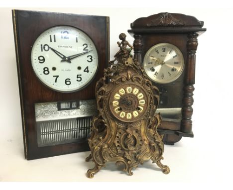 A brass ornate mantle clock (40cm tall) and two wall clocks, President and Holly. This lot cannot be posted