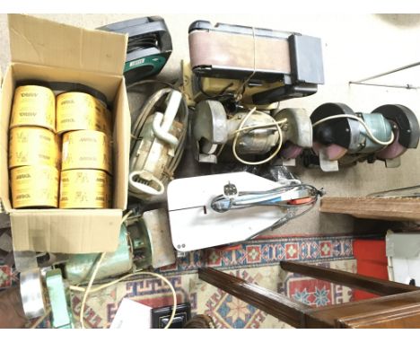 A collection of assorted power tools including sanding belt and polishing grinding wheels. Postage D