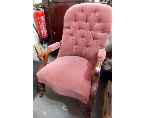 Victorian walnut button back armchair, upholstered with red velvet material.